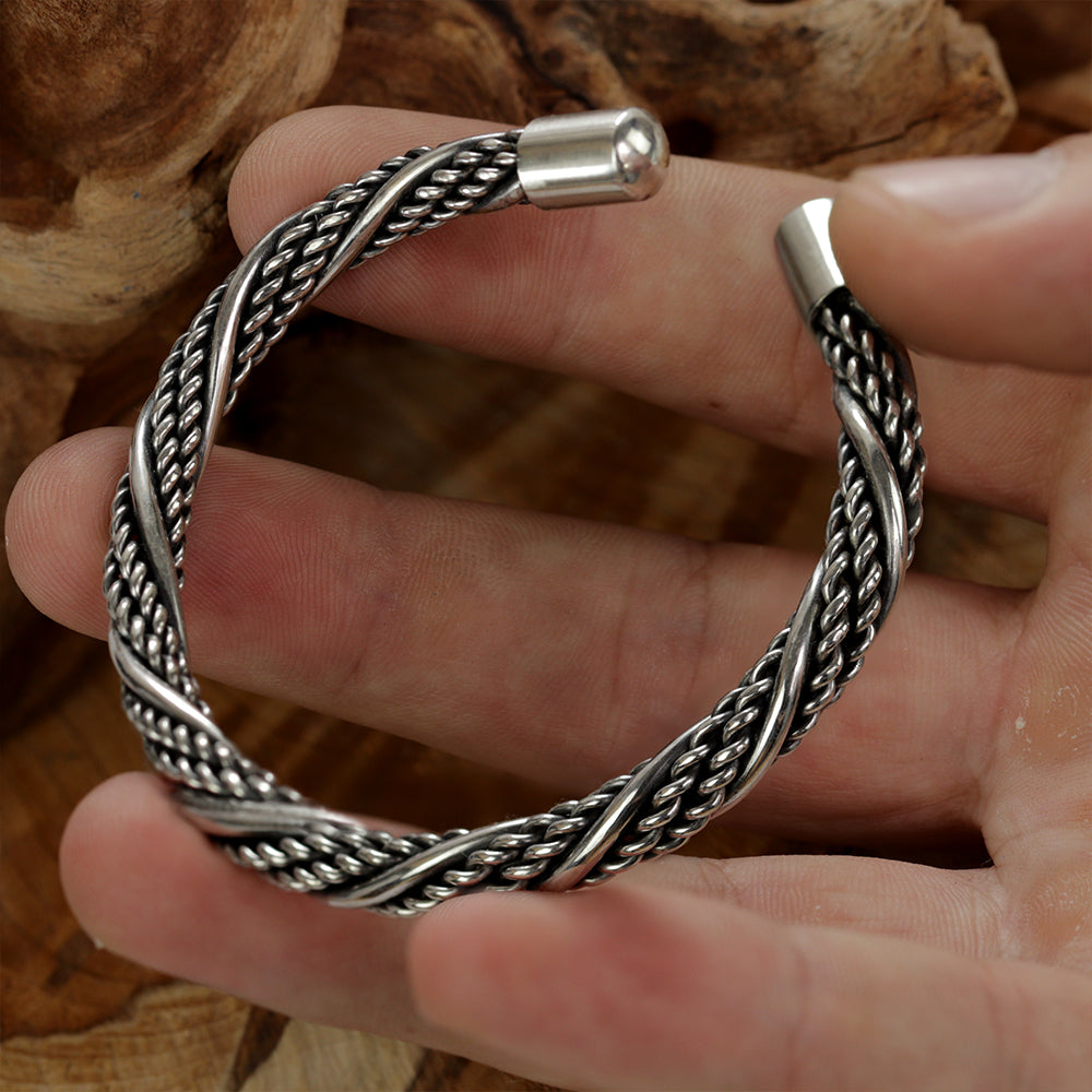 Sterlingsilver 925 Viking cuff holding in a hand showcasing high Contrast Surfaces