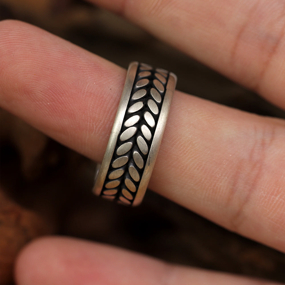 Engraved Eternal Bloom ring presented as handcrafted sterling silver jewelry, unisex fit.