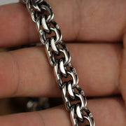 Macro shot highlighting the interlocking Mirage chain links of the sterling silver Bismarck bracelet.