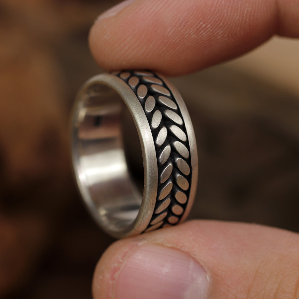 Close view of 925 sterling silver Eternal Bloom ring capturing detailed flower relief.
