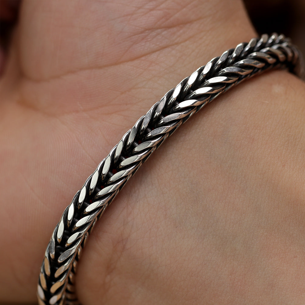 Men’s sterling silver fox tail bracelet showing detailed weaving and polished finish.
