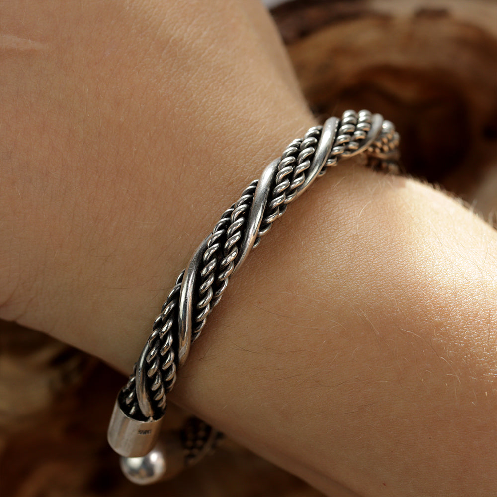 Darkened Silver Torc on a Wrist showing a close up
