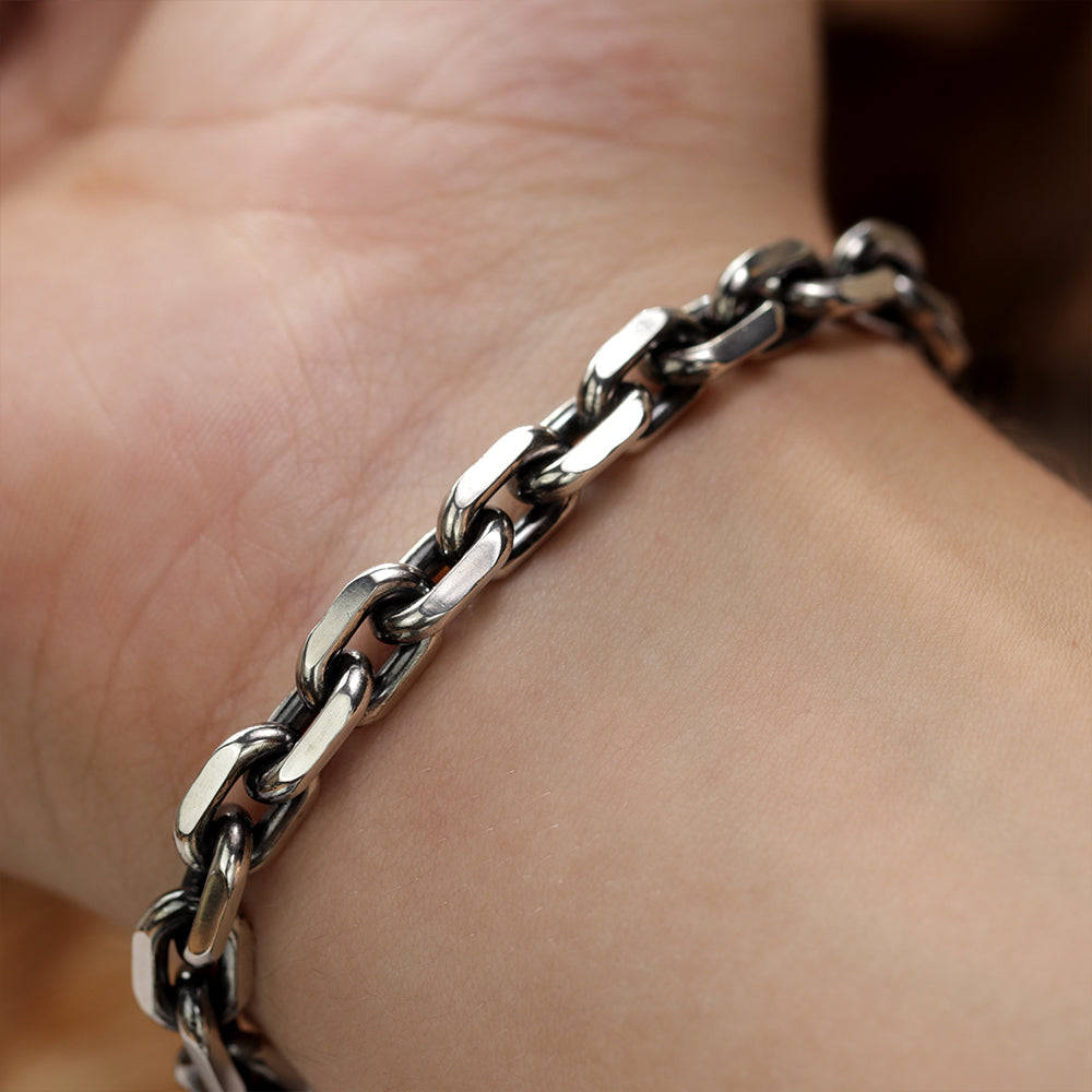 Handmade 925 sterling silver anchor bracelet for men with Monolith chain worn on the wrist.