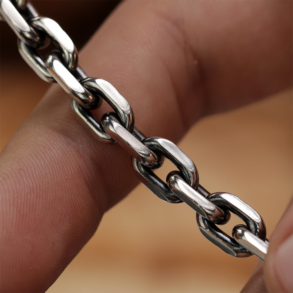 Close-up product shot of polished Monolith chain anchor bracelet made from 925 sterling silver.